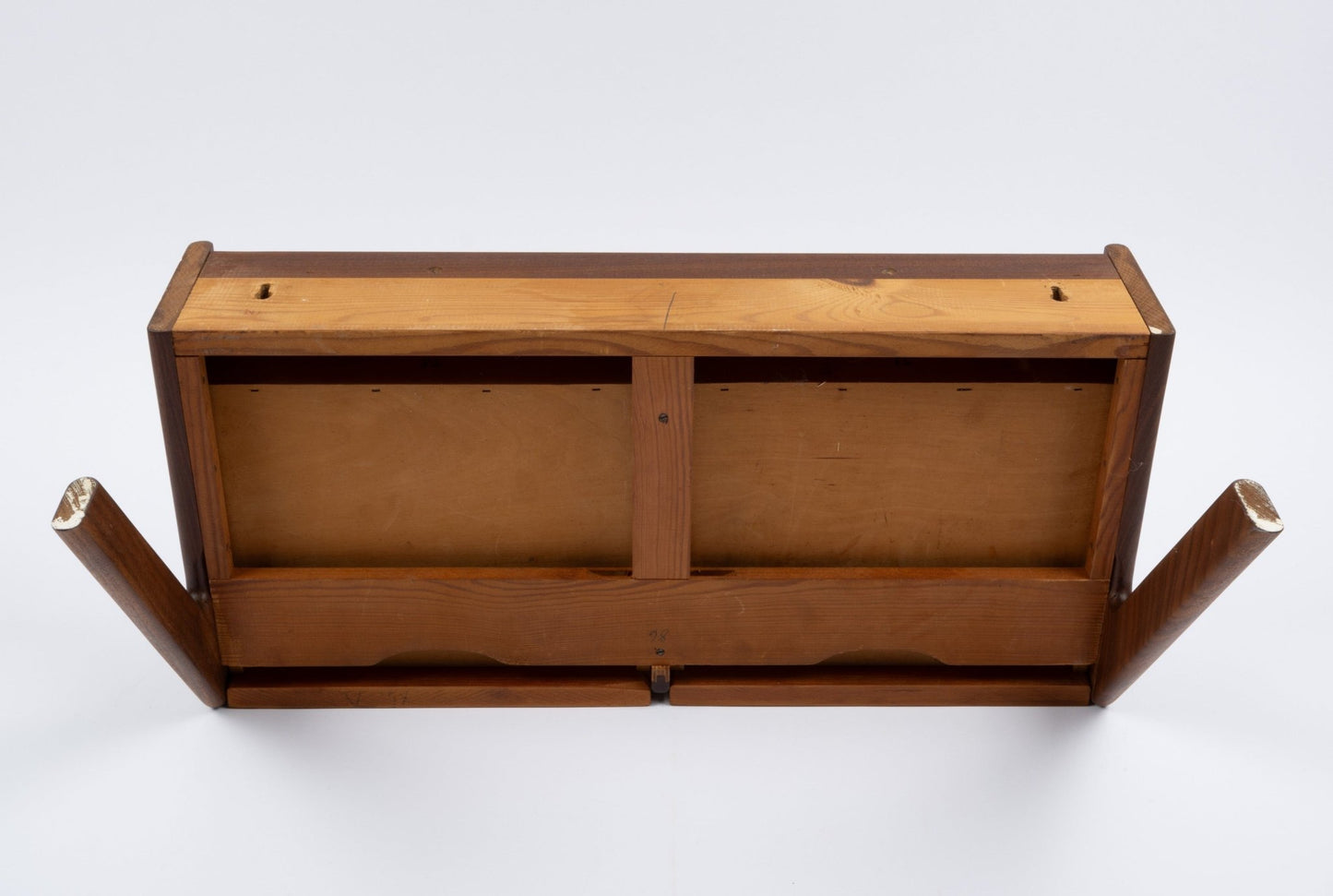 Danish modern teak wall shelf with drawer, viewed from below showing wood construction and mounting points.