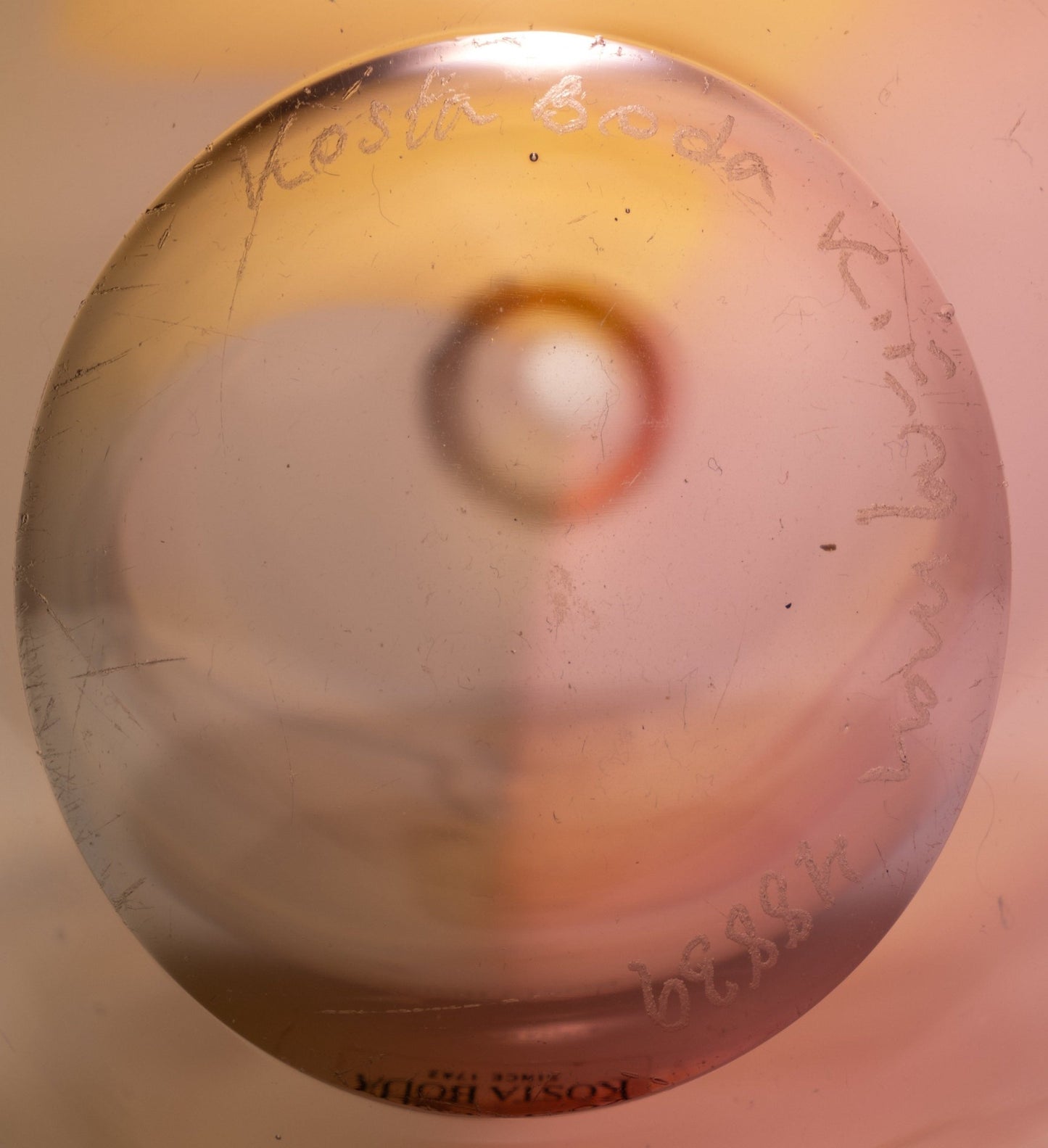 Close-up of the base of Kosta Boda Fidji glass bottle signed by Kjell Engman with artist collection inscription