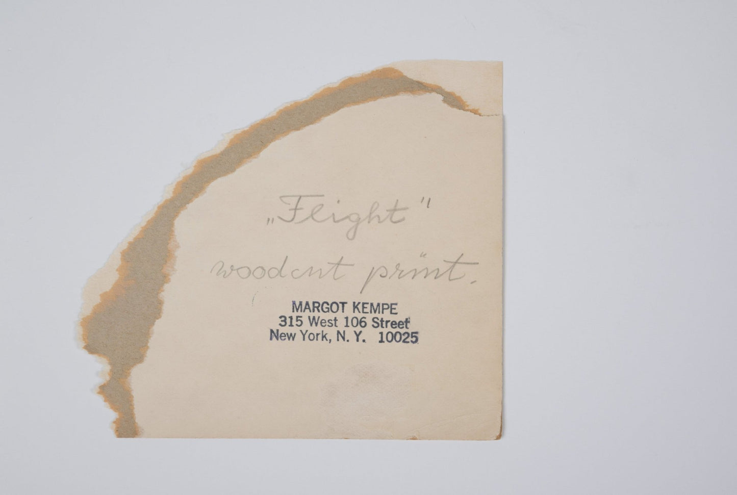 Handwritten note on aged paper for Margot Kempe print "Flight" with artist address stamp and torn edges.