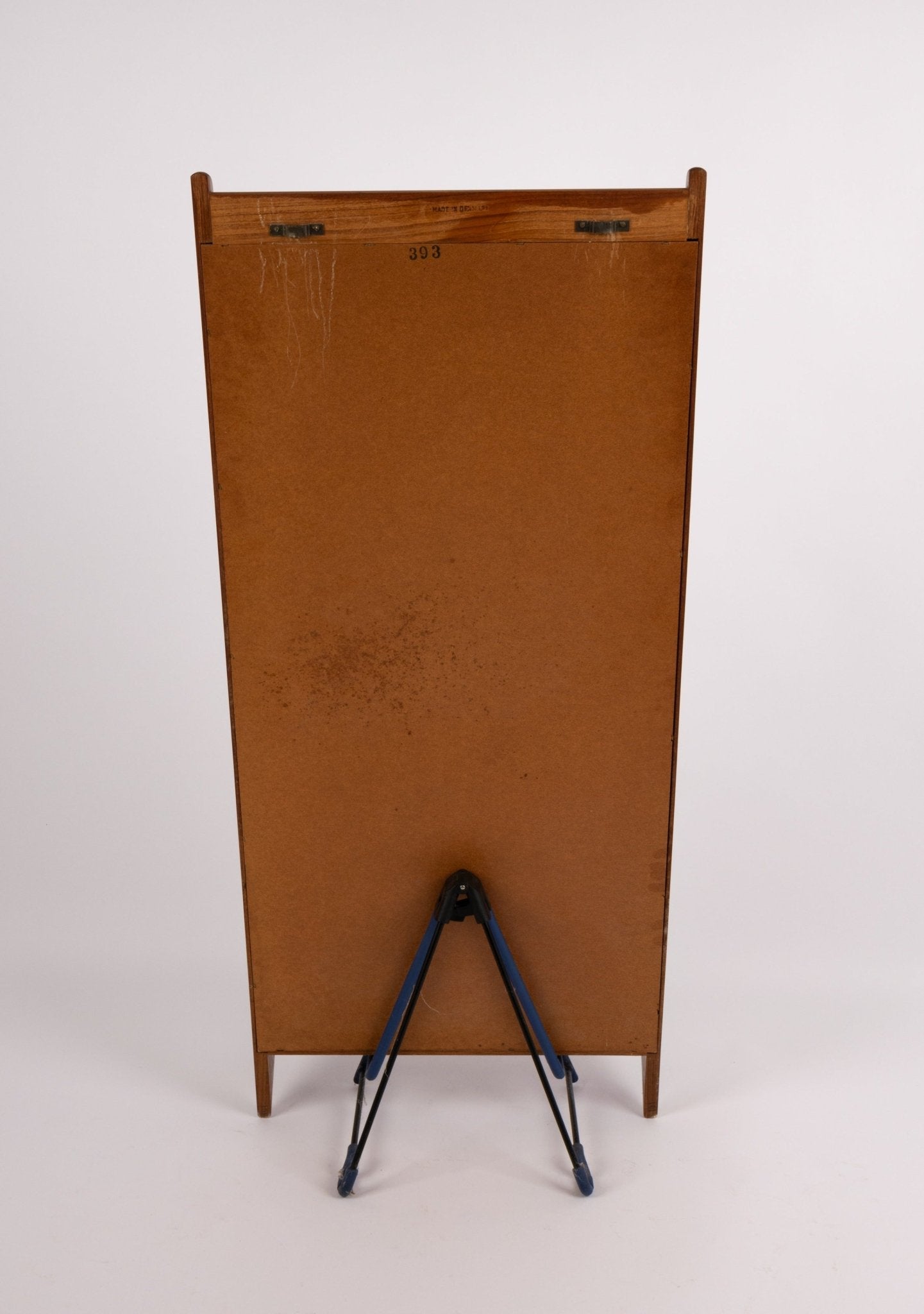 Back view of Pedersen & Hansen teak wall mirror with wooden frame and metal hanger hardware on white background.