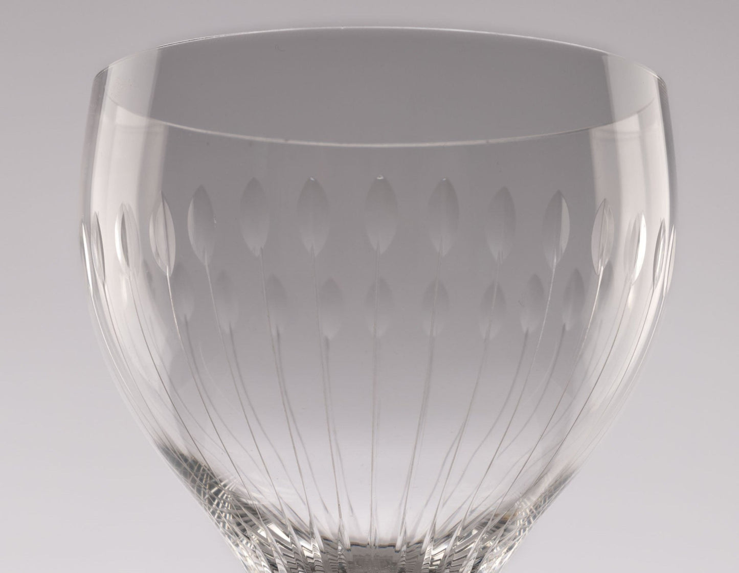Close-up of Rosenthal Lotus Cut crystal stemware with faceted oval petal design from 1960s Germany.