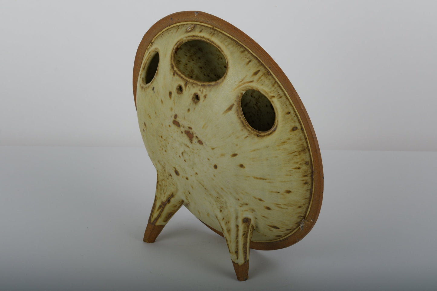 Ken Pick studio pottery vase from the 1980s with unique oval shape and three openings on a two-legged base