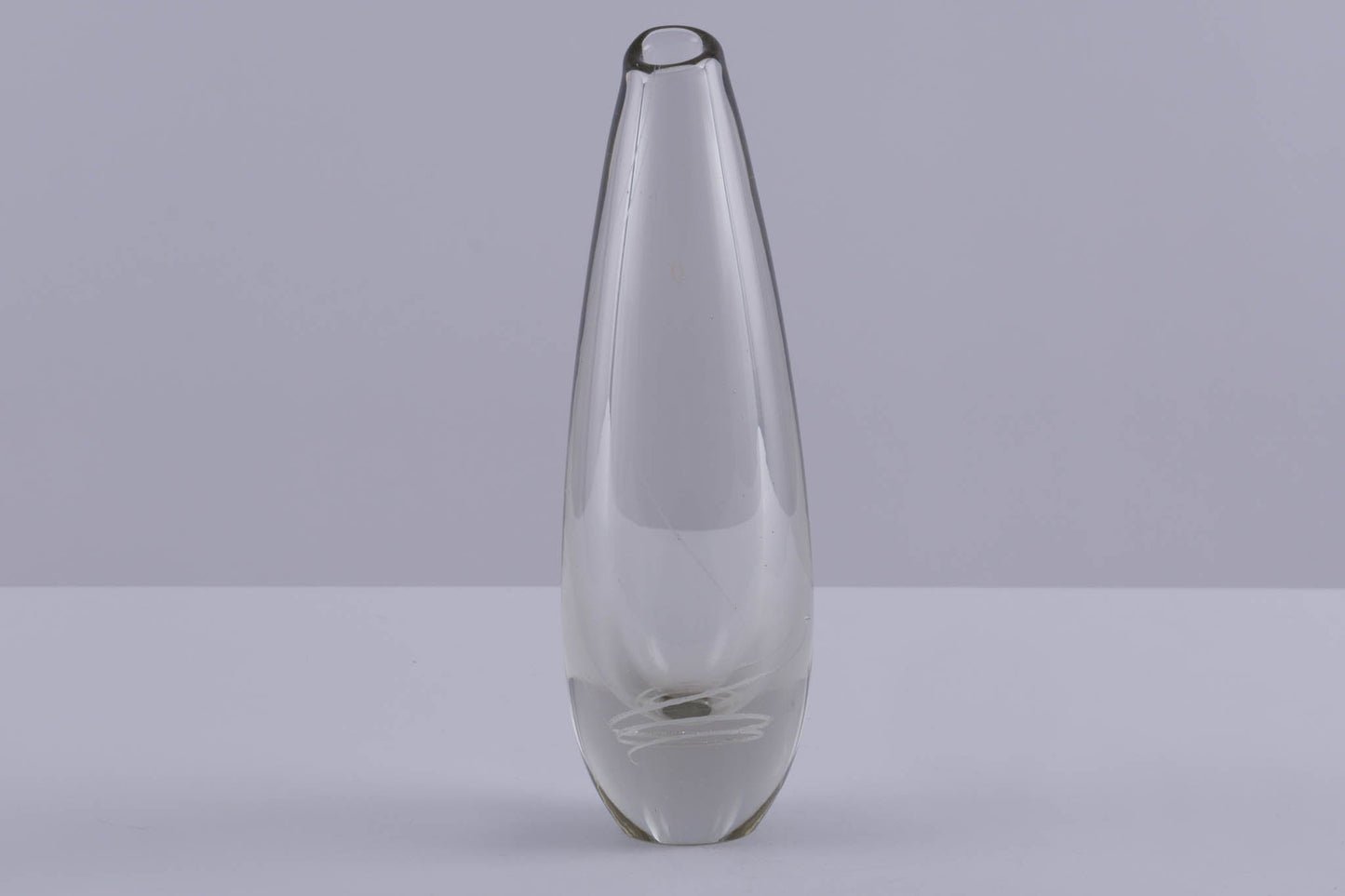 Tall clear glass vase with subtle inlaid spiral decoration, designed by Mikko Helander in Scandinavian style.