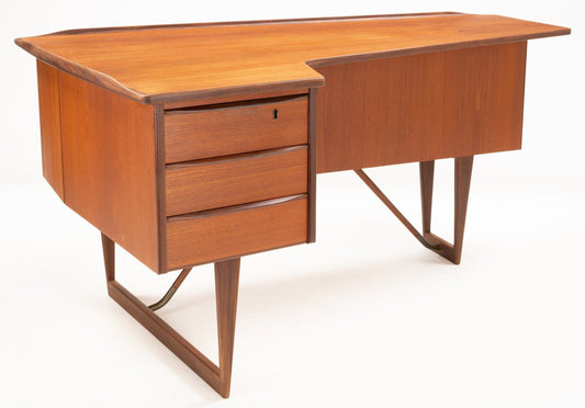 Picture of a Peter Løvig Nielsen 'Boomerang' Writing Desk in teak wood up against a white background