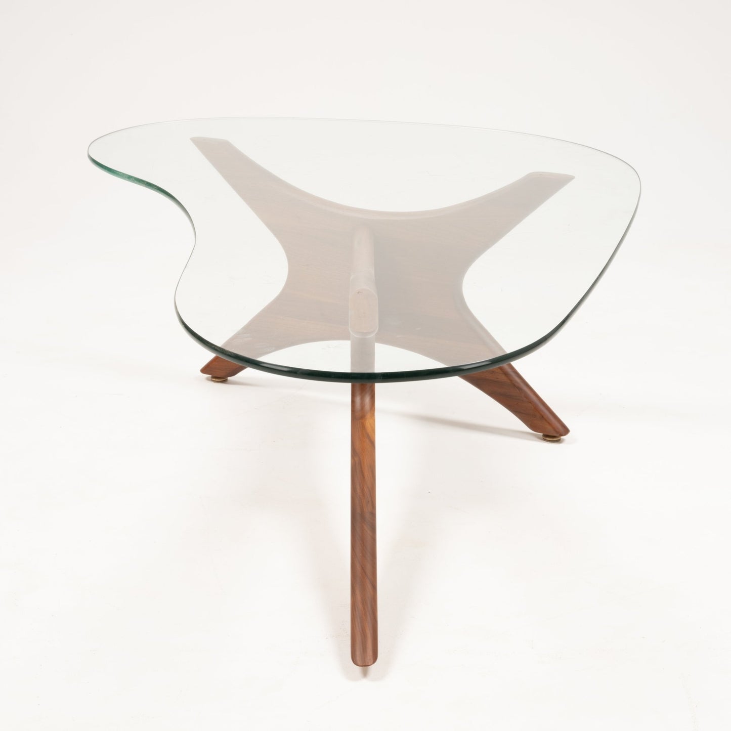 Adrian Pearsall coffee table with clear glass top and sculptural solid walnut base featuring four curved legs