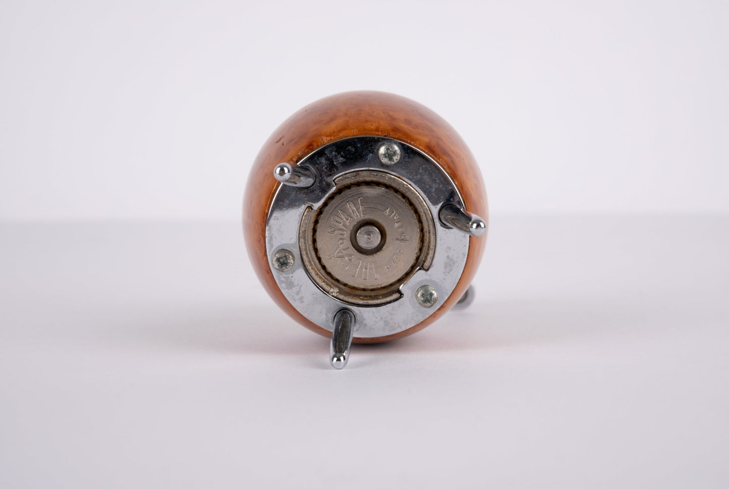 Bottom view of Alessi Twergi 1990s cherry wood peppermill with metal grinding mechanism and three metal feet