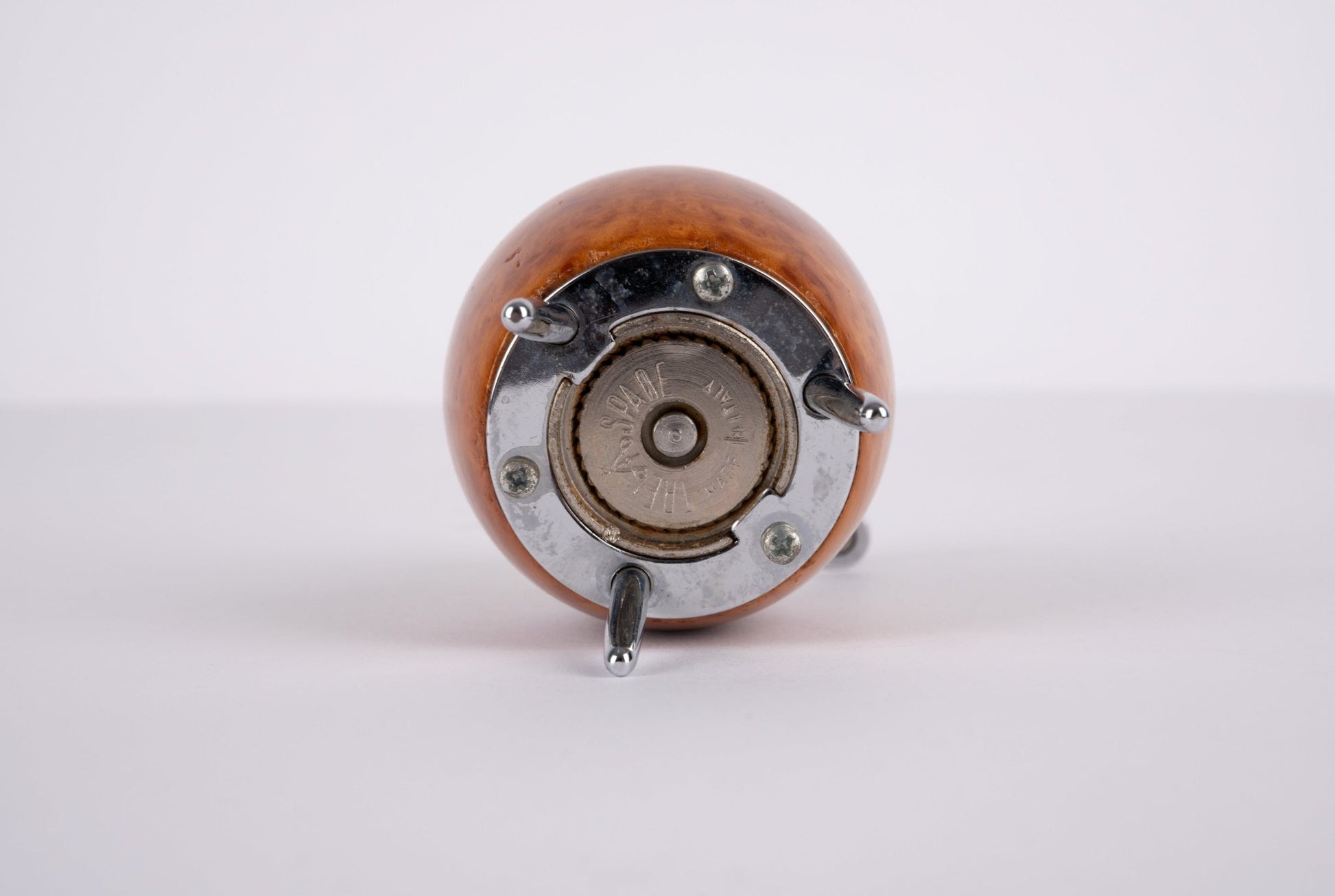 Bottom view of Alessi Twergi 1990s cherry wood peppermill with metal grinding mechanism and three metal feet