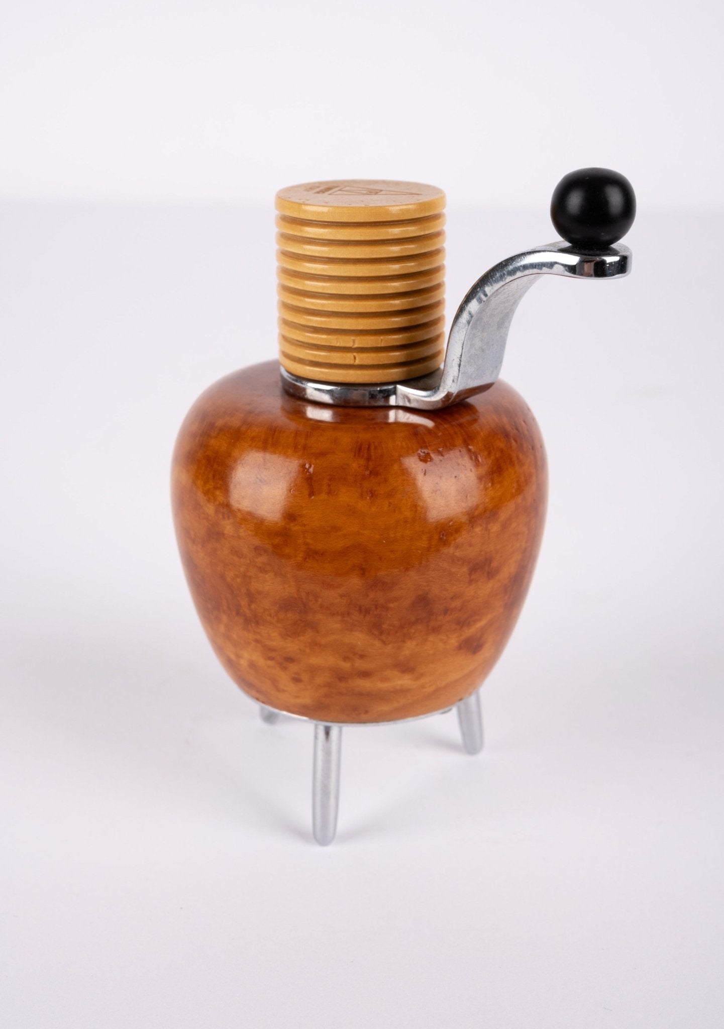 Alessi Twergi 1990s cherry wood peppermill with metal crank handle and three metal feet designed by Adalberto Pironi