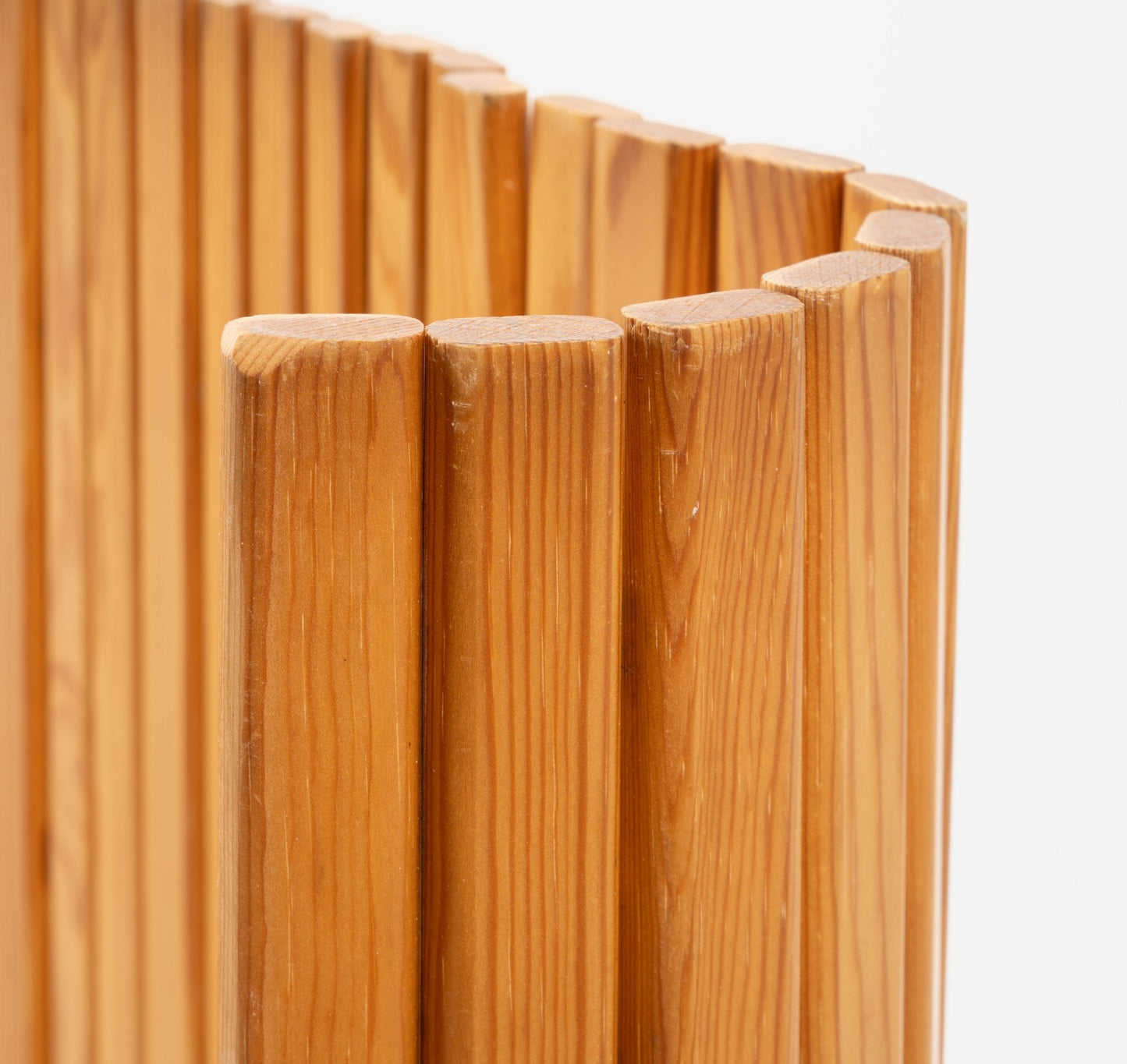 Close-up of Alvar Aalto 'Screen 100' room divider showing vertical pine slats with smooth natural finish on white background