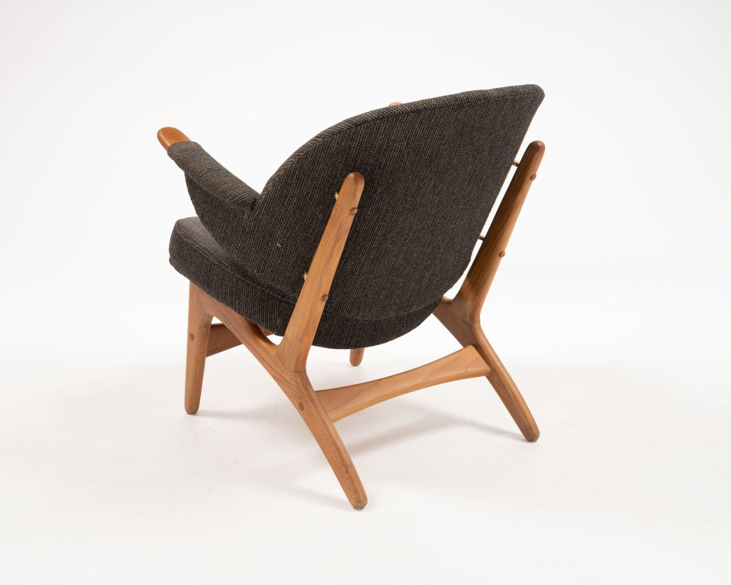 1950s Arne Hovmand-Olsen Danish chair in solid teak with winged backrest and dark fabric upholstery from Denmark warehouse