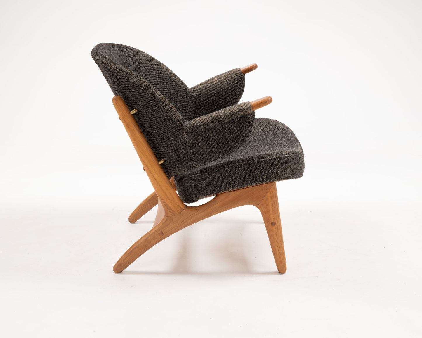 1950s Arne Hovmand-Olsen chair in solid teak with dark upholstery and distinctive winged backrest from Denmark