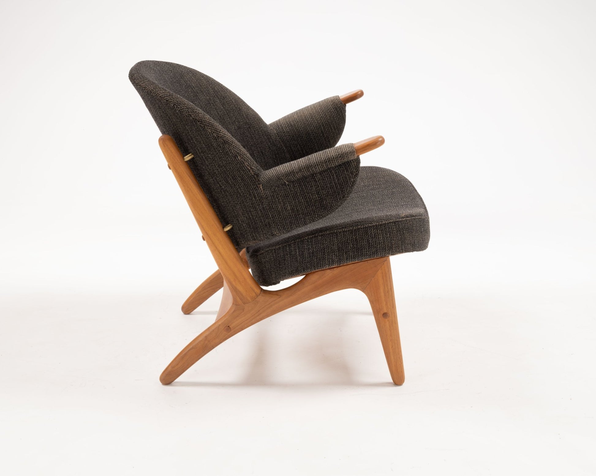 1950s Arne Hovmand-Olsen chair in solid teak with dark upholstery and distinctive winged backrest from Denmark