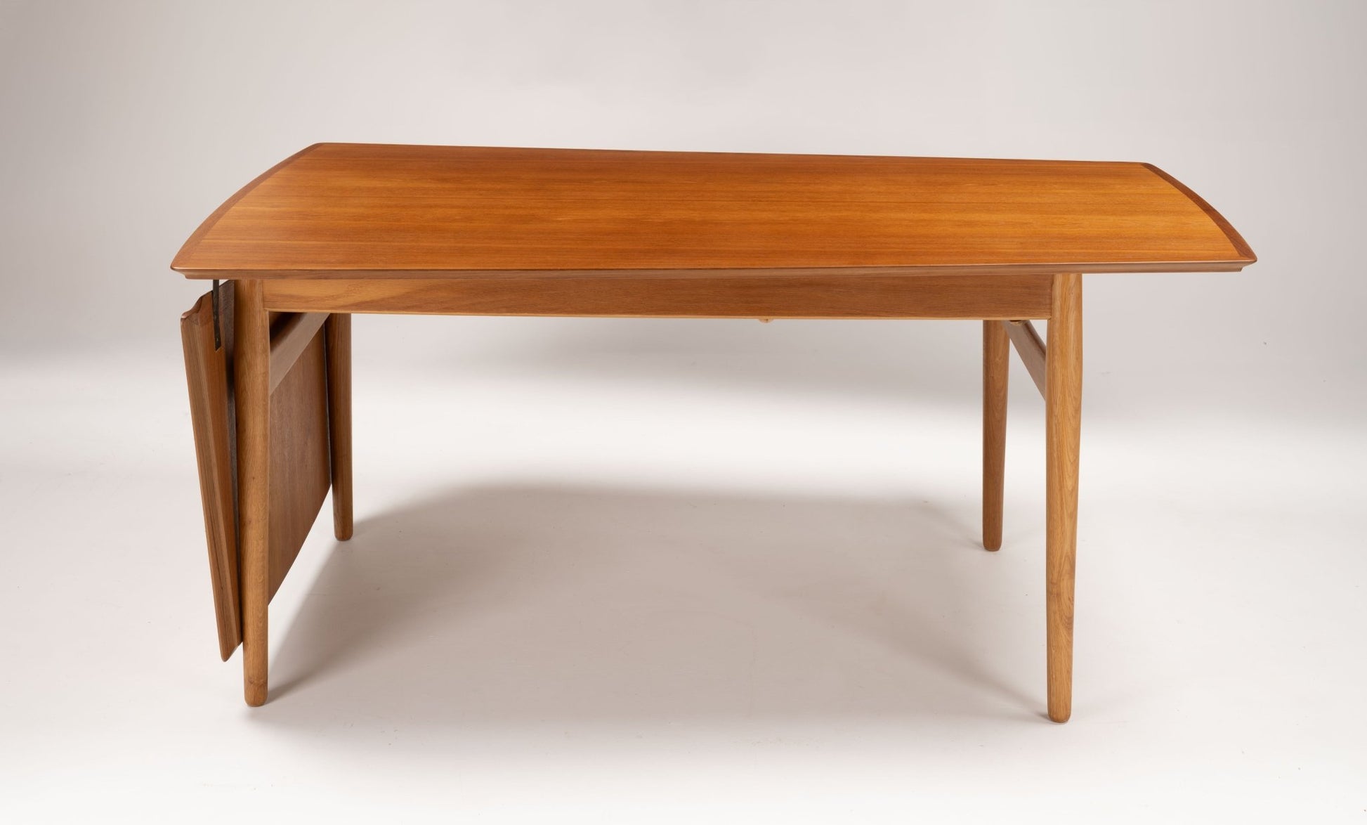Arne Vodder mid-century modern teak drop leaf desk with tapered legs and hinged side extension leaf