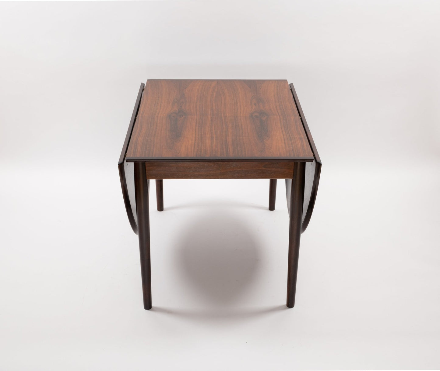 Arne Vodder mid-century modern rosewood drop leaf dining table with solid tapered legs and expandable design