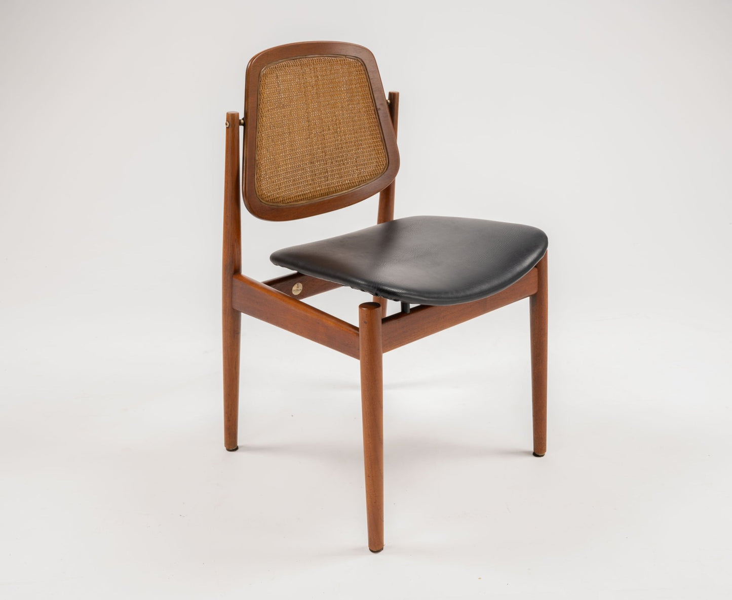 1950s Danish teak dining chair with black leather seat and woven backrest, adjustable with brass fittings