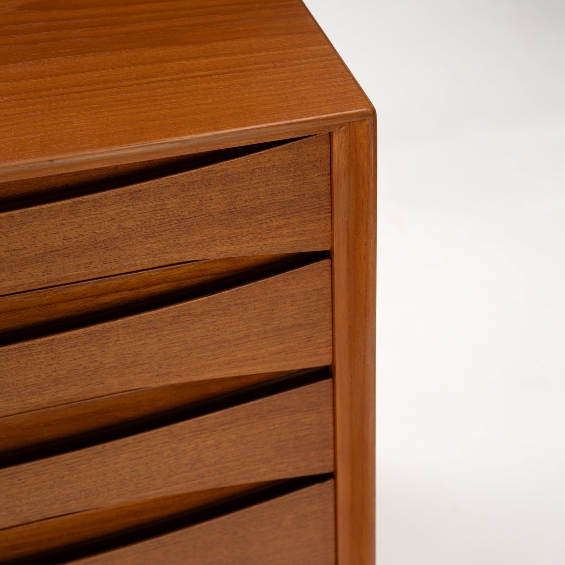 Arne Vodder Reversible-Drawer Teak Credenza for Sibast showing close-up of sculpted teak drawer fronts with recessed handles and smooth finish, highlighting mid century modern craftsmanship.
