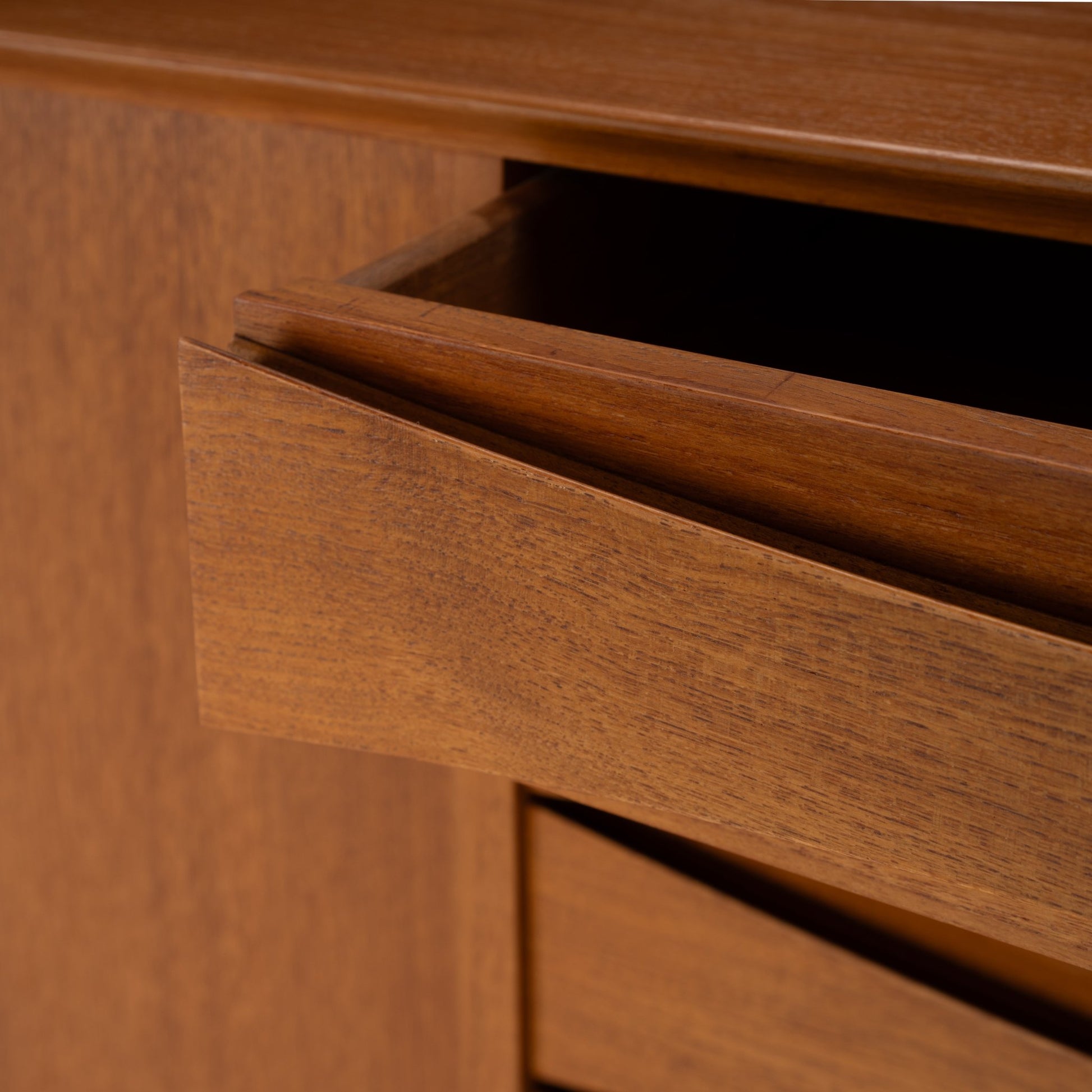 Arne Vodder Reversible-Drawer Teak Credenza for Sibast showing close-up of warm teak wood drawer with smooth finish and subtle grain, highlighting precise joinery and mid century modern design.
