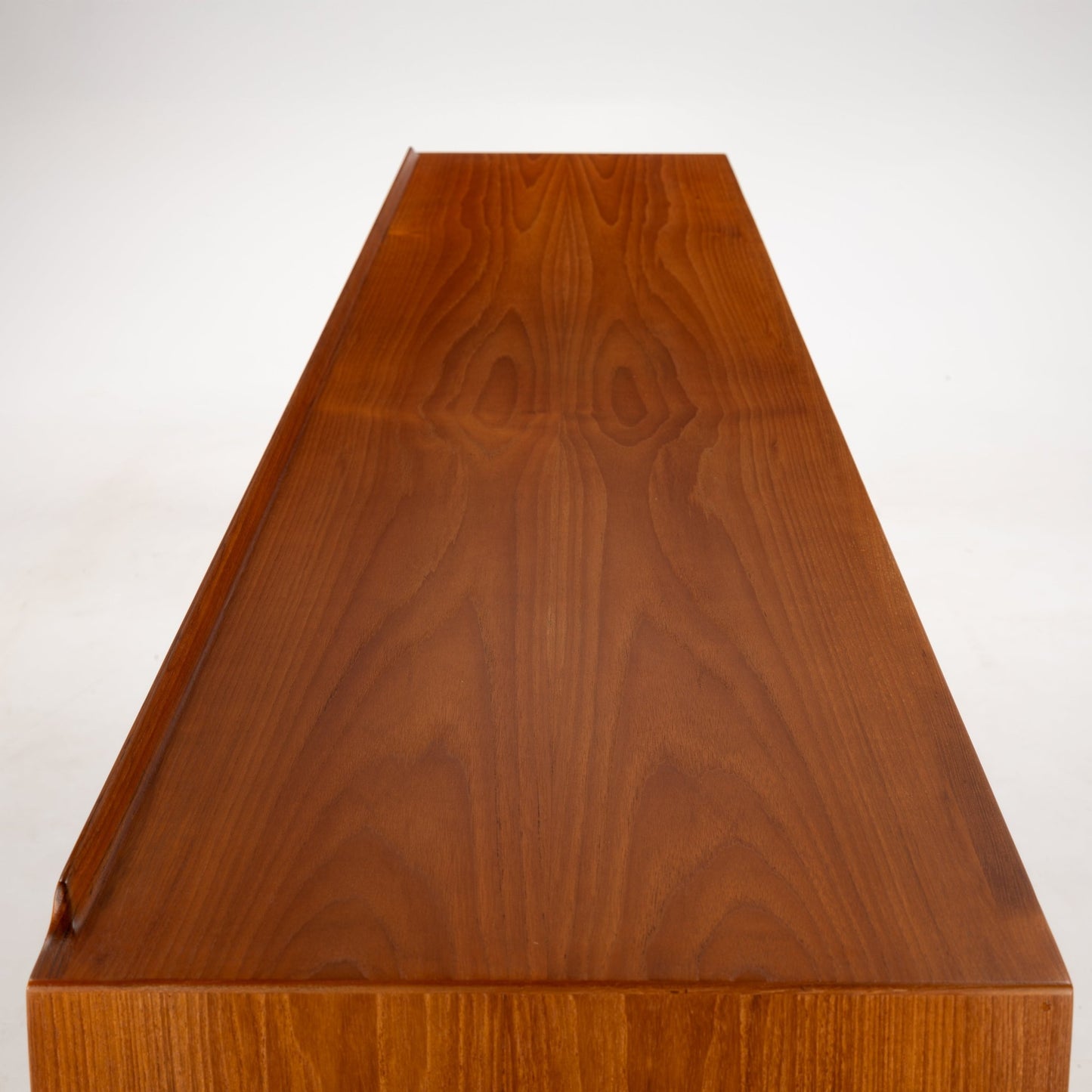 Arne Vodder Reversible-Drawer Teak Credenza for Sibast showing the rich teak wood surface with visible grain patterns and a sleek, polished finish emphasizing mid century modern storage design.