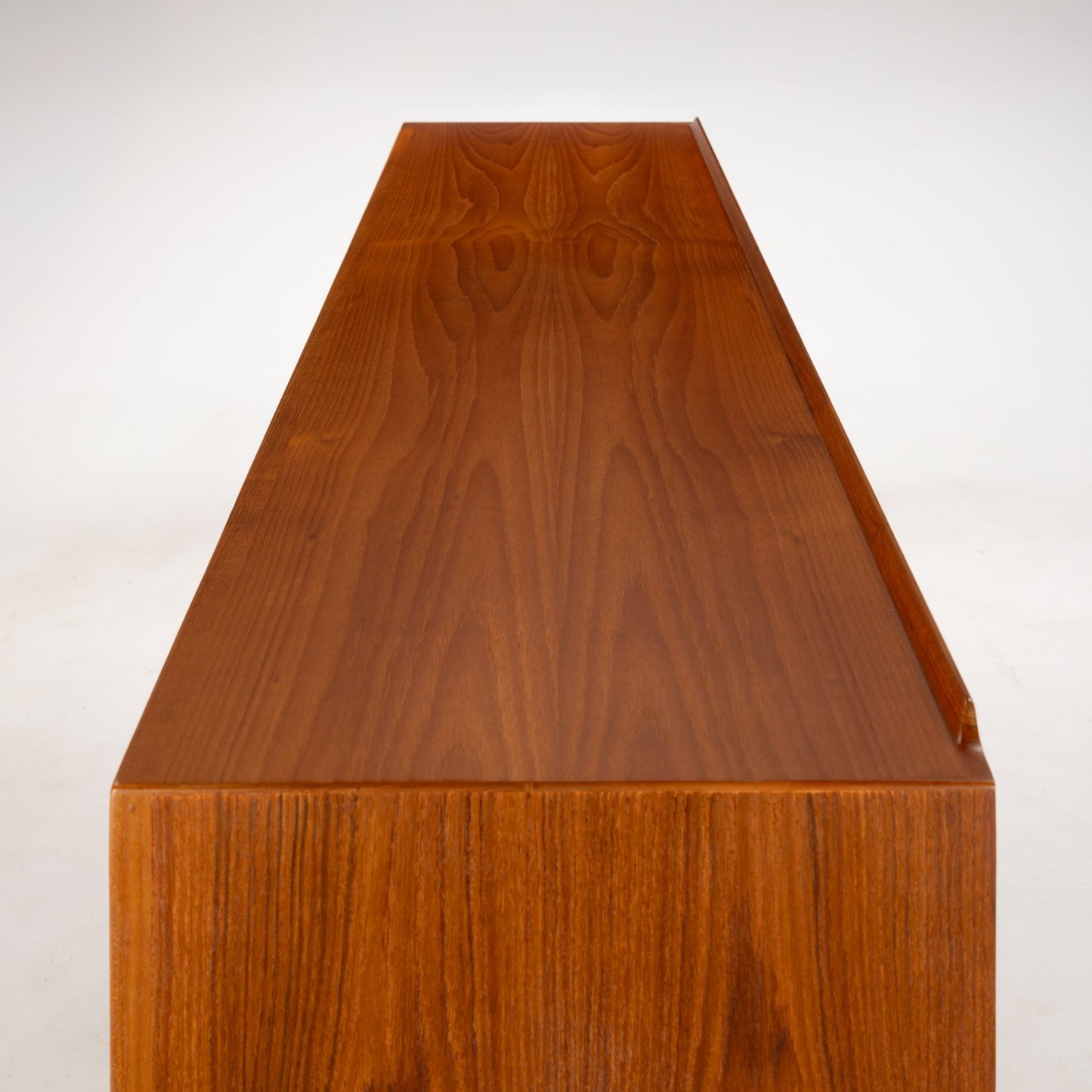 Arne Vodder Reversible-Drawer Teak Credenza for Sibast highlighting the smooth teak wood top with a rich grain pattern and clean lines showcasing vintage Danish mid century modern furniture design.