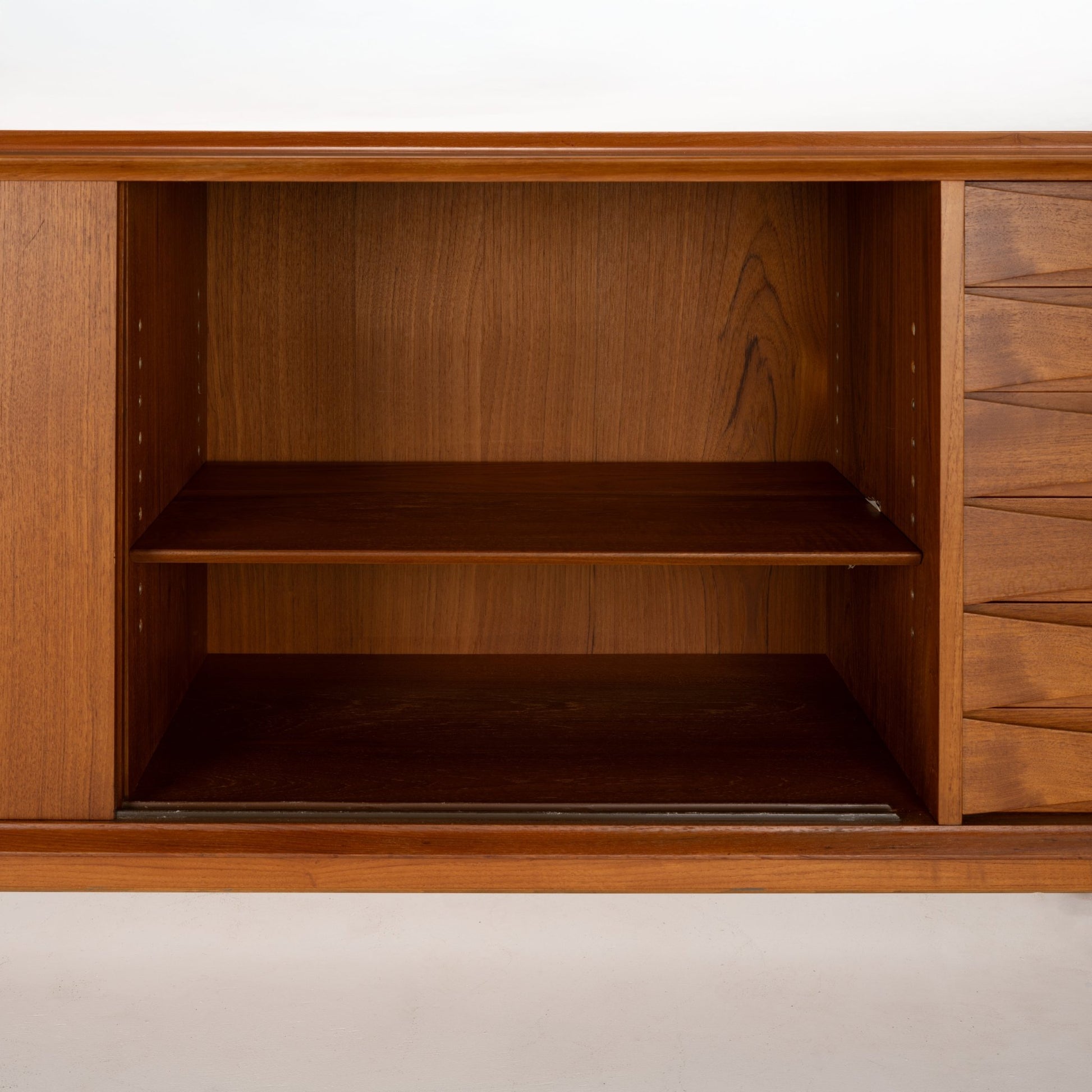 Arne Vodder Reversible-Drawer Teak Credenza for Sibast showing open central storage compartment with adjustable shelf, crafted from warm teak wood highlighting vintage Danish mid century modern design.