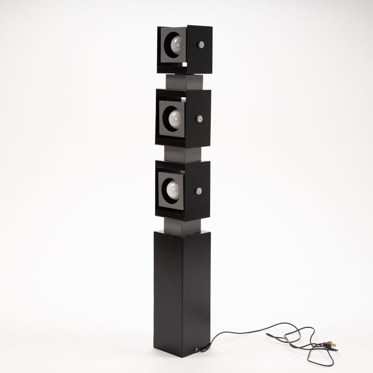 Arteluce Swivel Steel Floor Lamp in black steel with three stacked square spotlights and a slim rectangular pedestal for contemporary lighting interiors