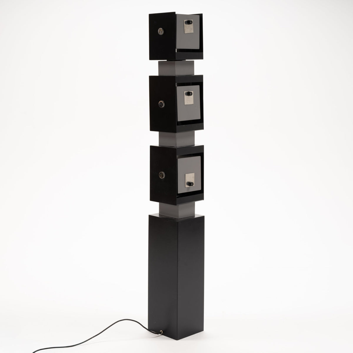Arteluce Swivel Steel Floor Lamp in black steel with three stacked square spotlight housings on a tall rectangular base for modern interior lighting