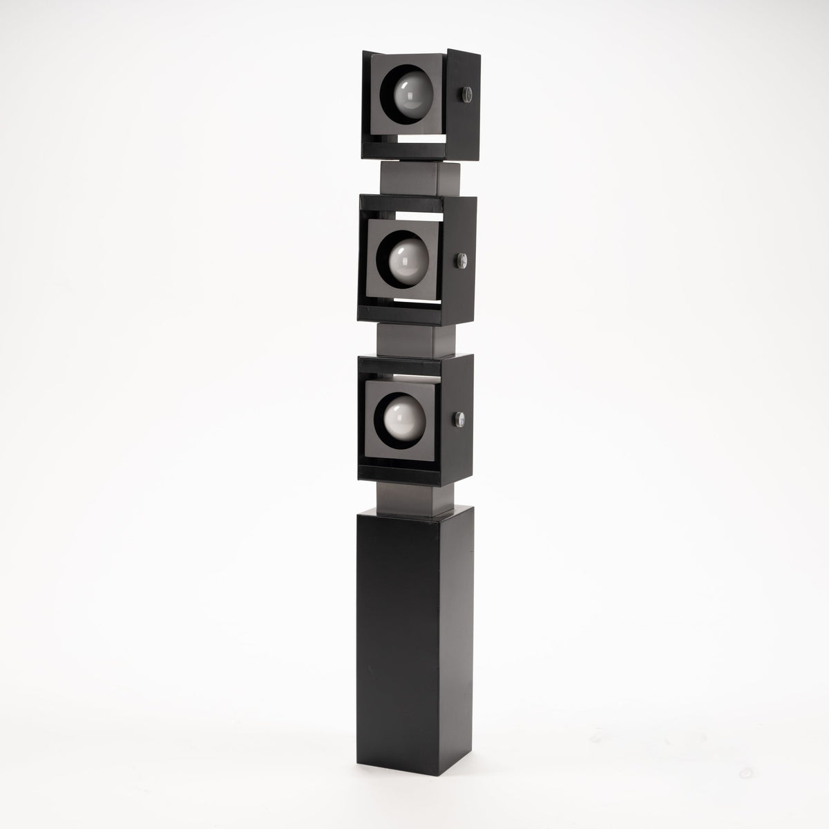 Arteluce Swivel Steel Floor Lamp with three stacked square adjustable spotlights on a black steel column in modern lighting design