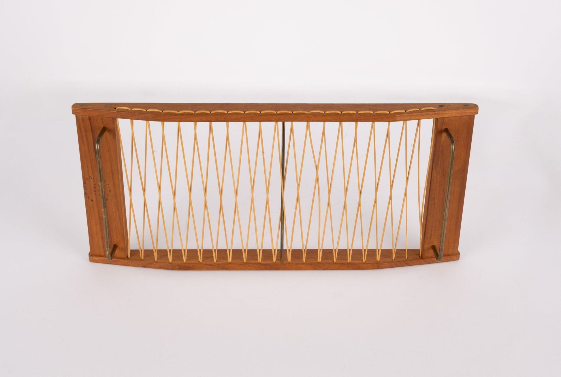 Danish mid-century modern teak bread tray with woven rattan center and brass hardware on frame edges
