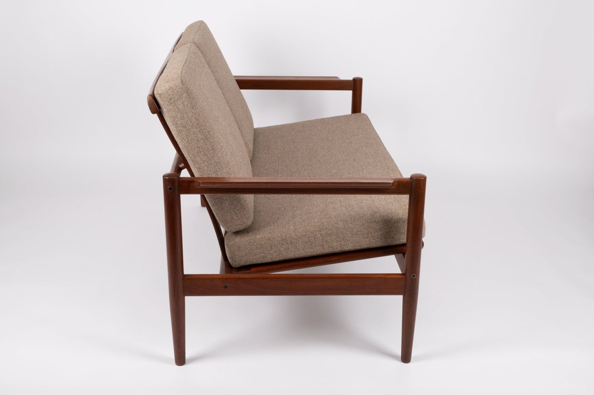 1960s Borge Jensen Danish teak settee with sculpted armrests and newly upholstered wool cushions from Denmark