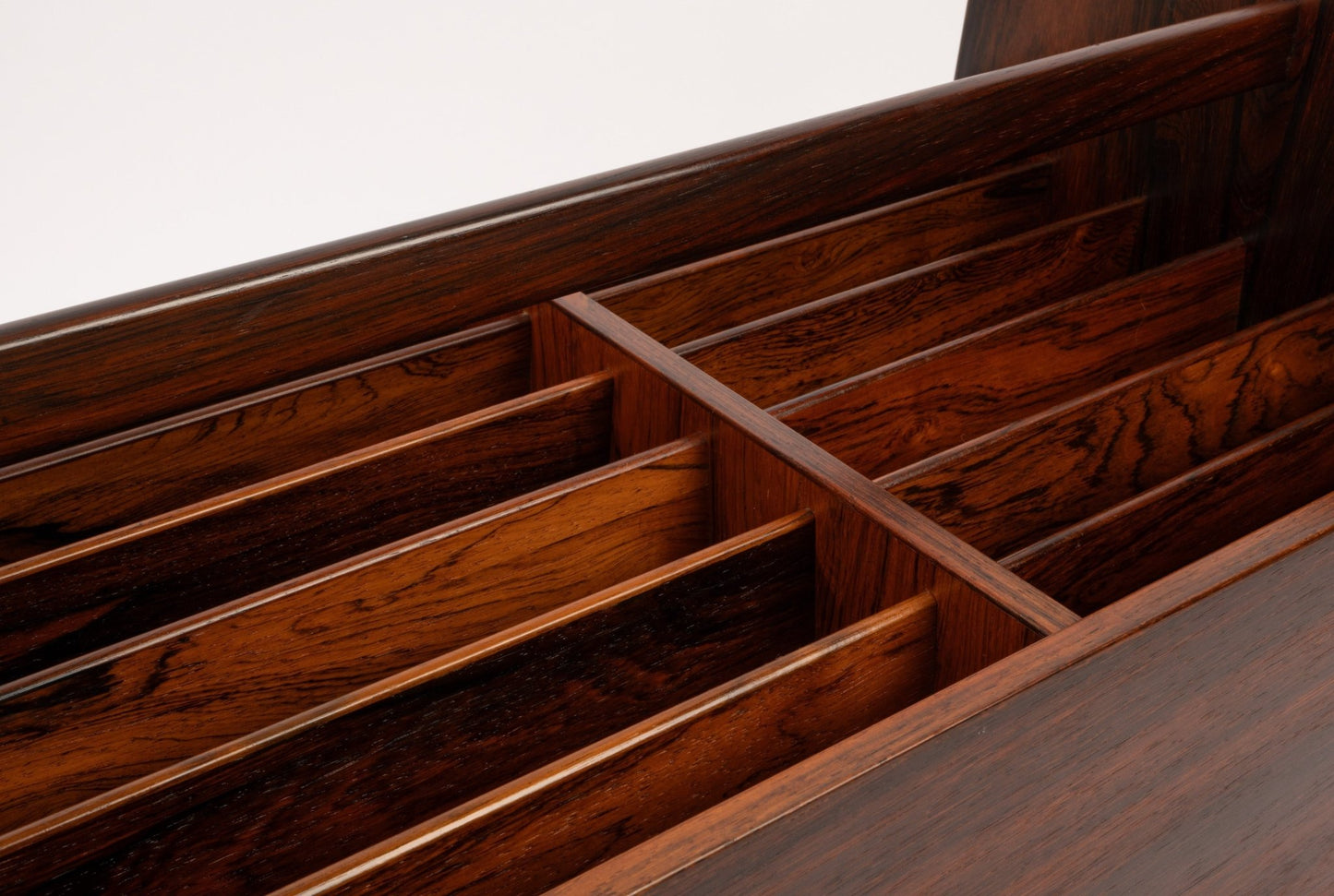 Close-up detail of rosewood rolling cart interior dividers showcasing rich wood grain and craftsmanship