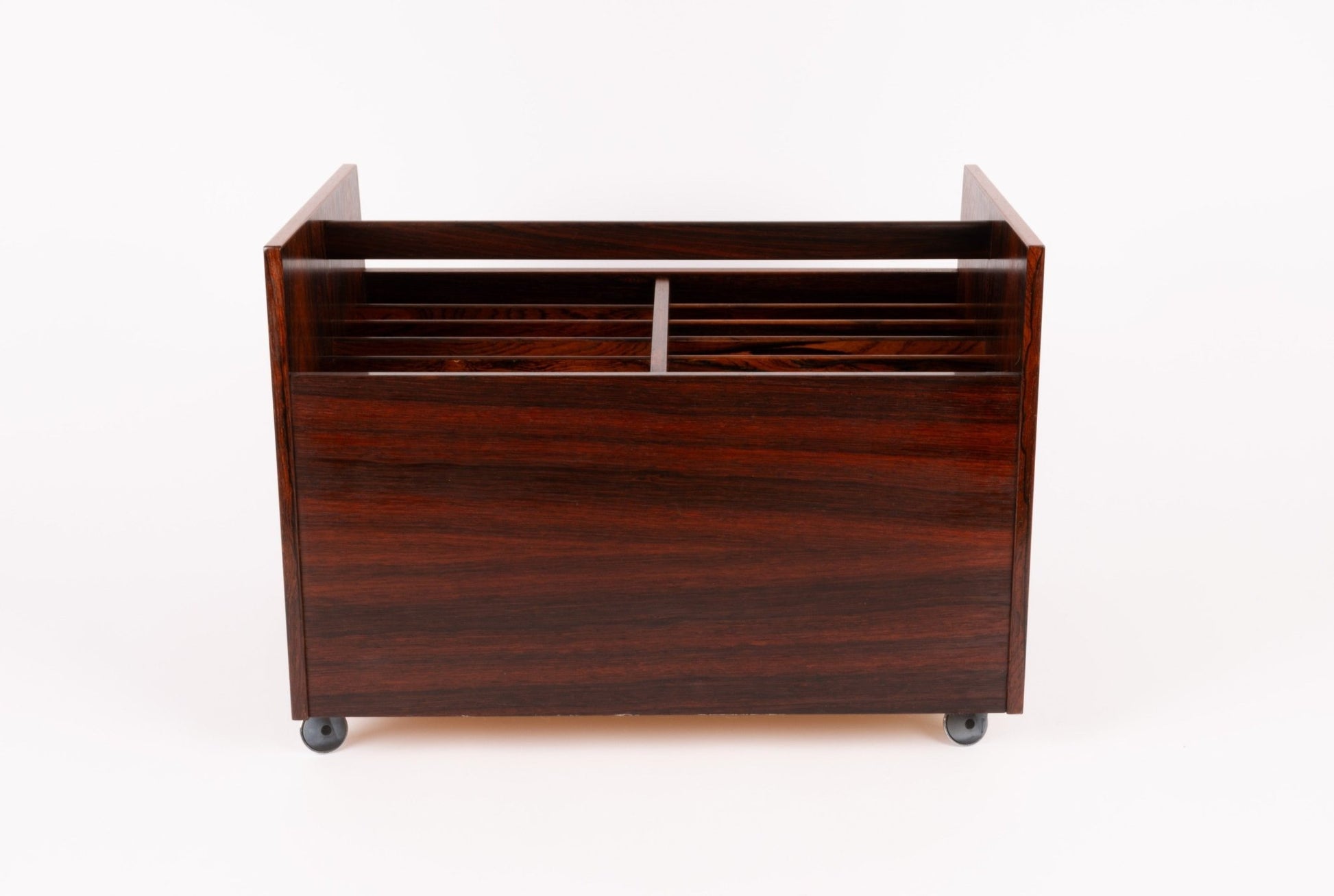 Bruksbo mid-century modern rosewood rolling cart with double-wide design and castors for easy mobility on white background.