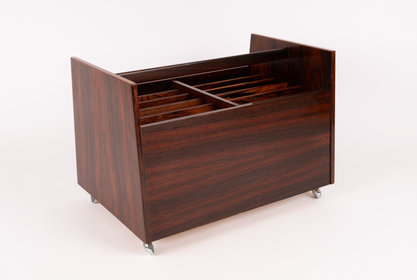 Bruksbo rosewood rolling cart with double-wide compartments and castors, ideal for magazine or record storage.