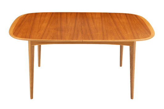 Danish Butterfly-Leaf Teak Dining Table with rounded top and tapered legs in vintage Danish furniture style