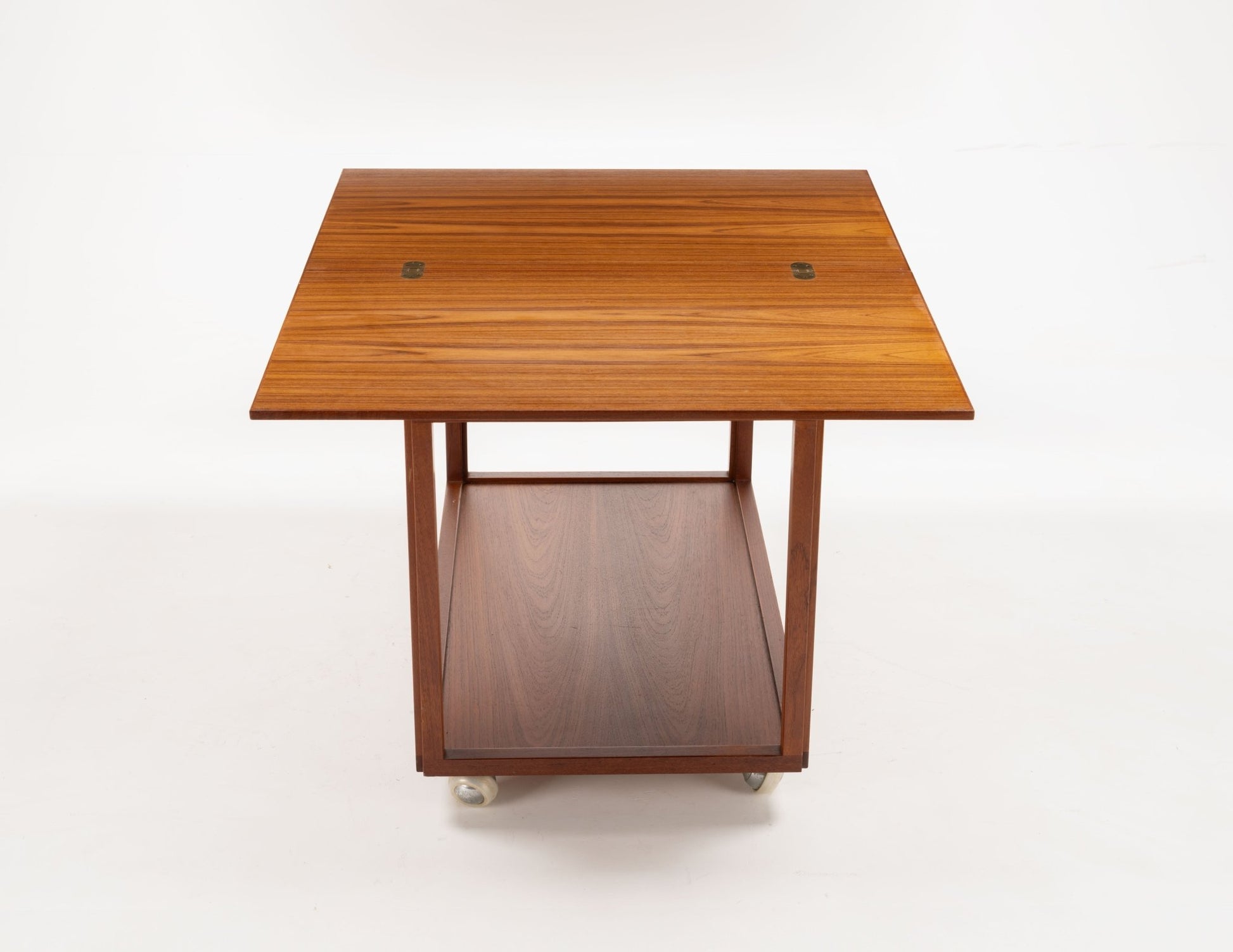 Danish teak expanding bar cart with clean lines and casters, featuring a flip-top for double surface space.