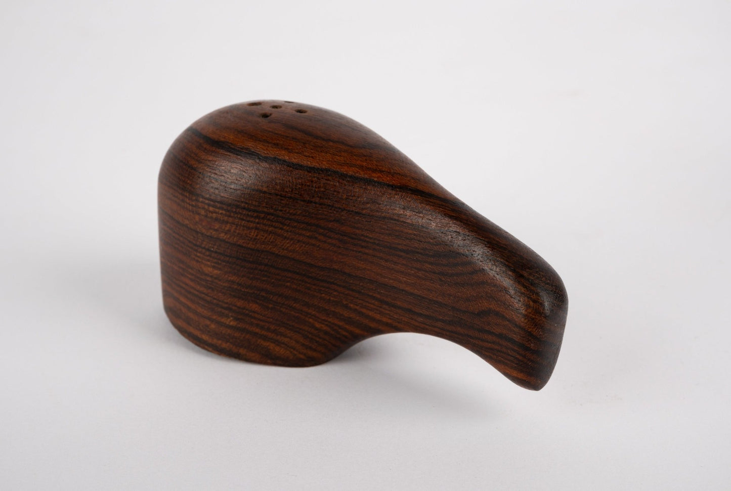Single Don Shoemaker interlocking salt or pepper shaker sculpted from solid rosewood by Mexican artisans Señal.