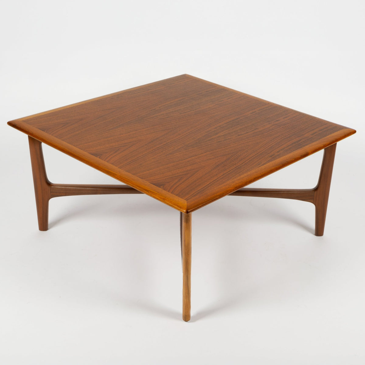 DUX Square Coffee Table by Ohlsson in rich walnut with a square top curved support frame and tapered legs against a white background for mid century modern furniture