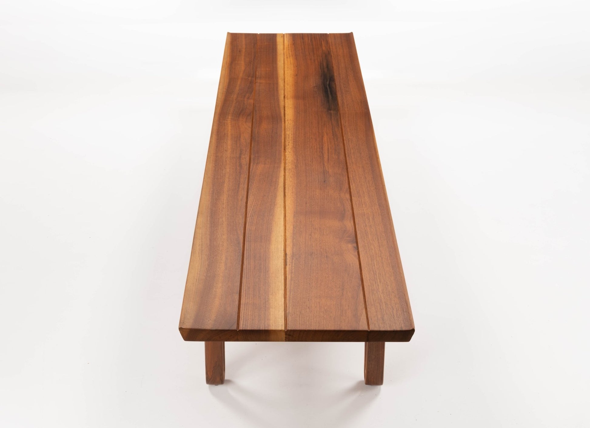 Edward Wormley "Long John" solid walnut coffee table with bentwood hairpin legs and sculpted upturned edges.