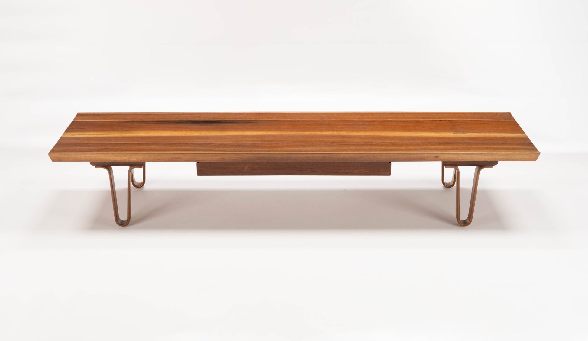 Edward Wormley "Long John" coffee table with solid walnut top, bentwood hairpin legs, and sculpted upturned edges.
