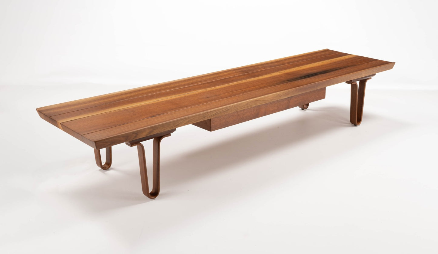 Edward Wormley "Long John" coffee table in solid walnut with bentwood hairpin legs and sculpted upturned edges on 84" top