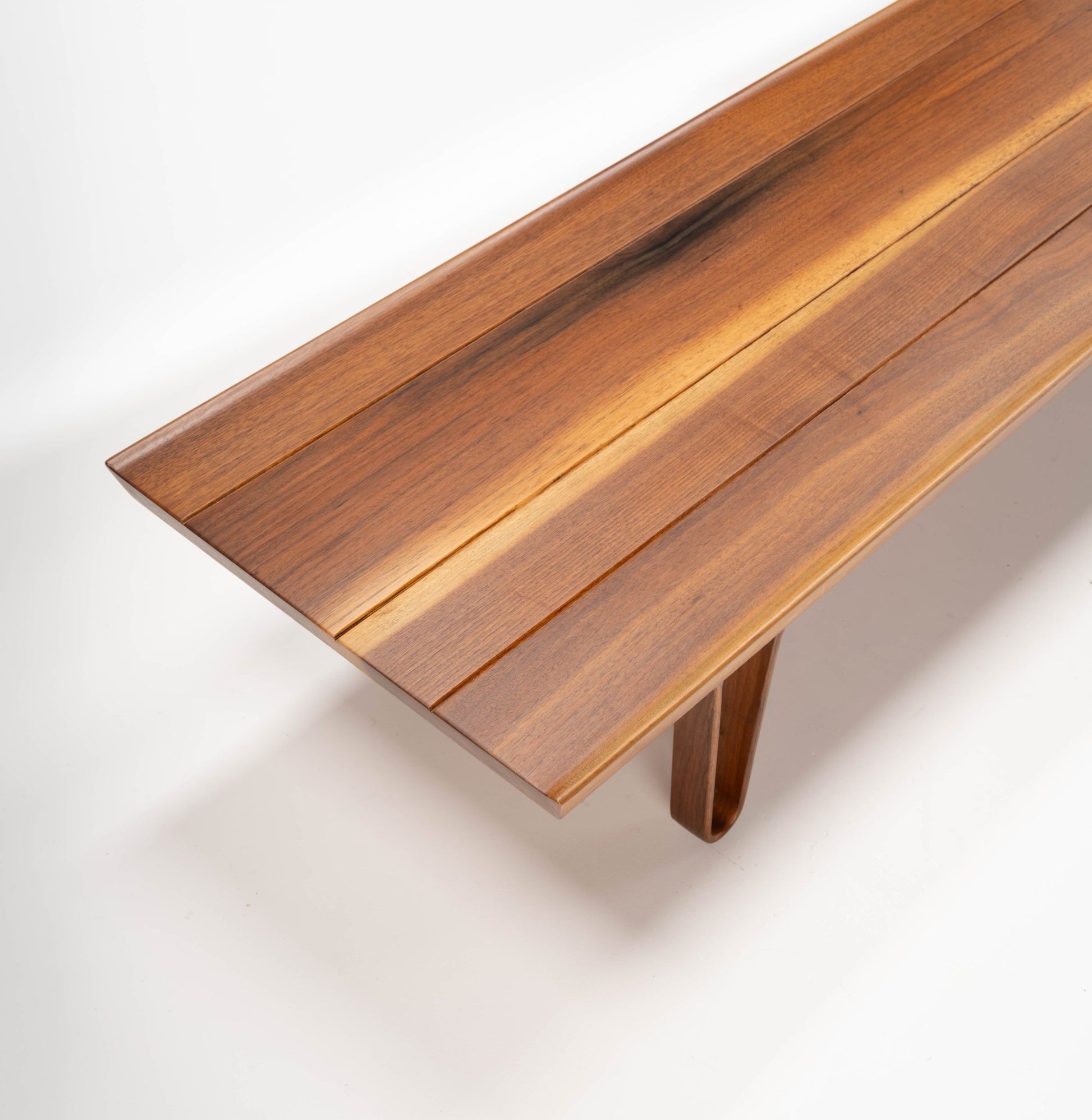 Edward Wormley "Long John" solid walnut coffee table with bentwood hairpin legs and sculpted upturned edges on 84" top