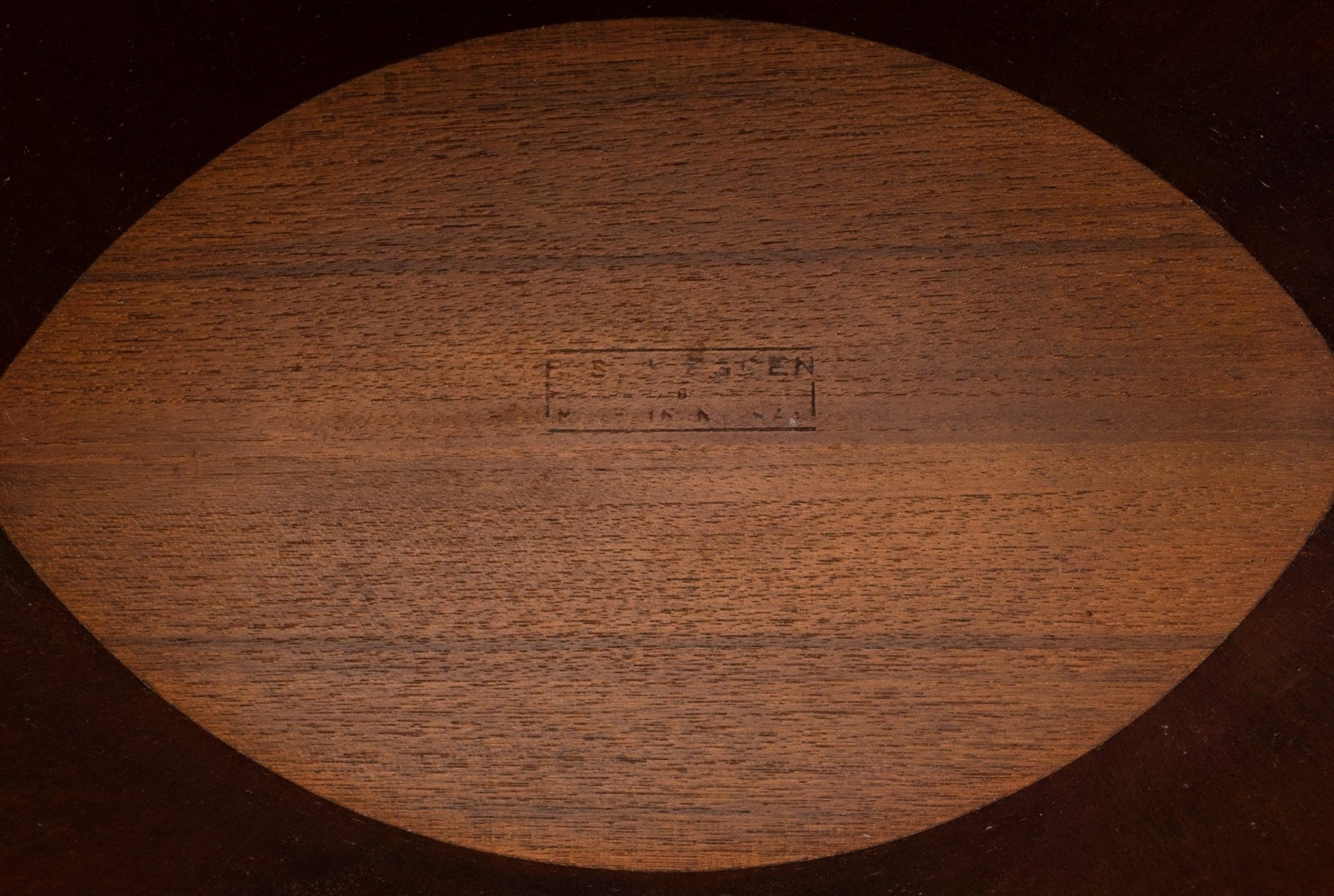 Bottom view of Einar Barnes teak wastebasket with maker's stamp from 1960s Norway, showing solid wood grain detail