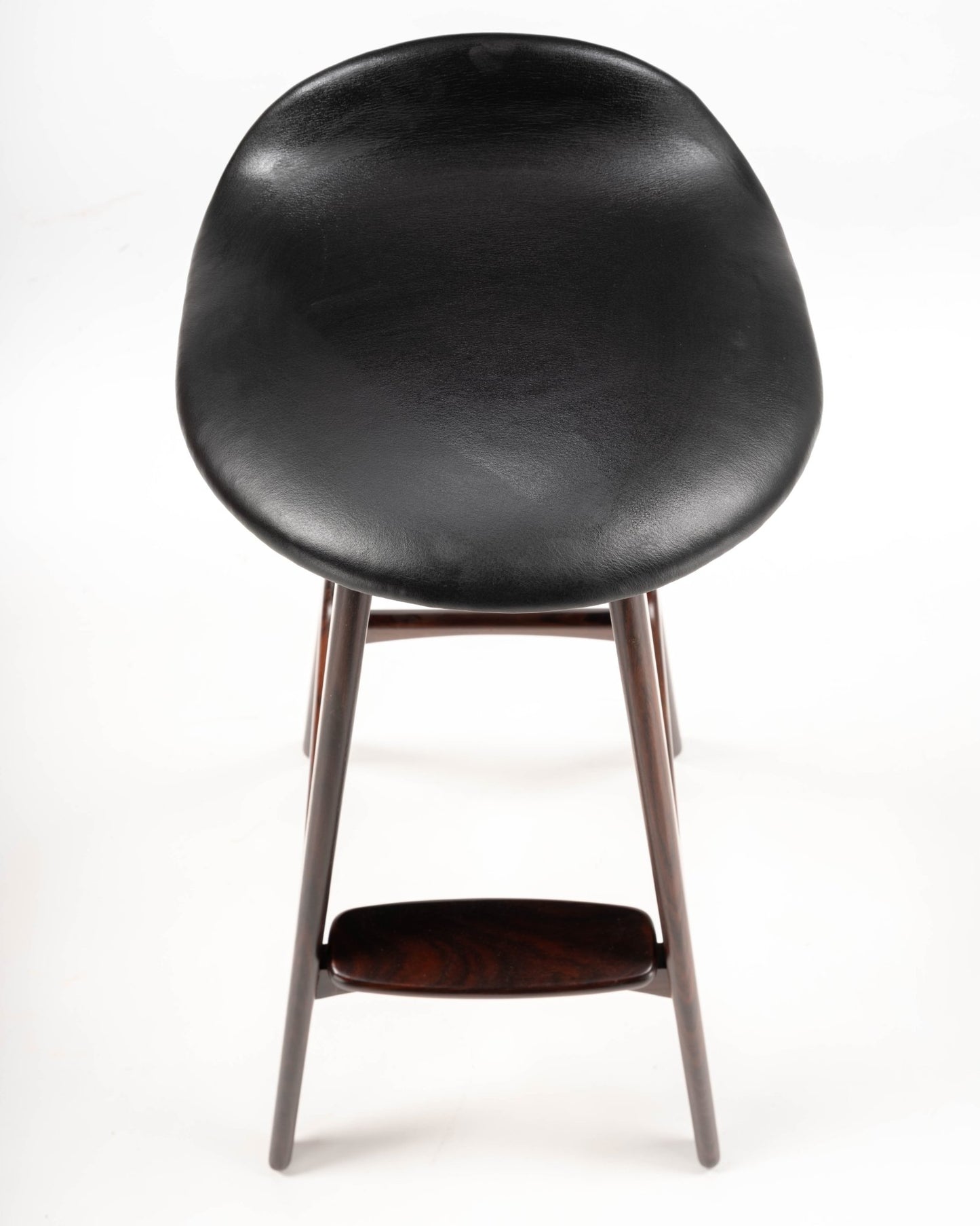 Mid-century modern Erik Buch bar stool with black leather contoured seat and rosewood frame with footrest