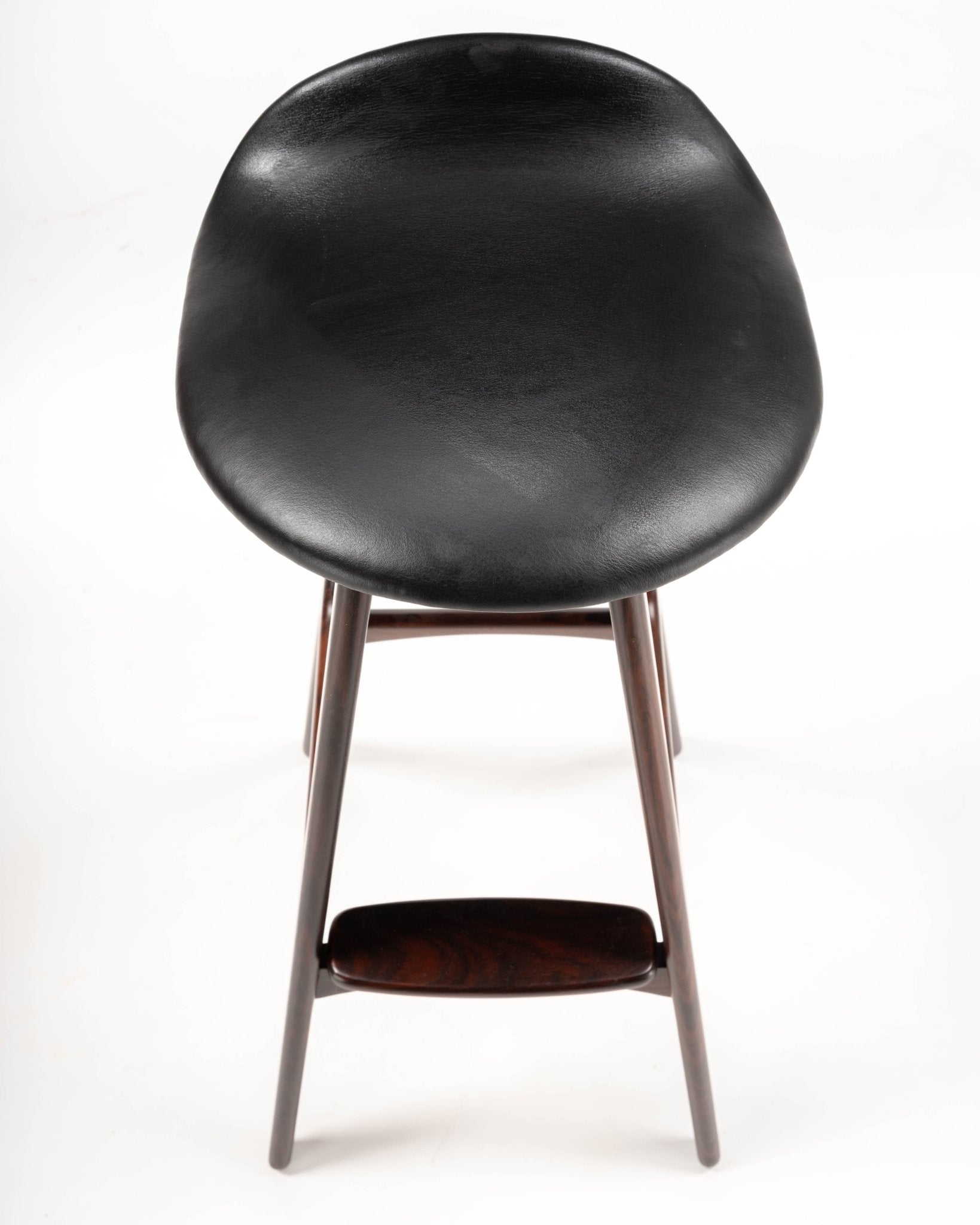 Mid-century modern Erik Buch bar stool with black leather contoured seat and rosewood frame with footrest