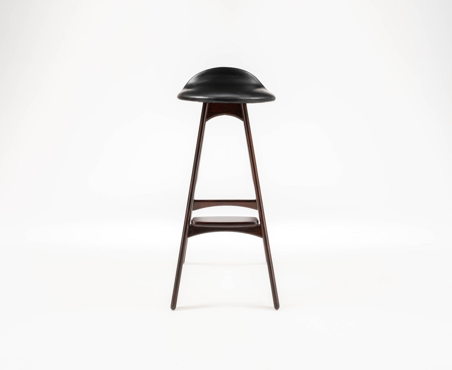 Erik Buch mid-century modern rosewood bar stool with black leather contoured seat and slim tapered legs on white background