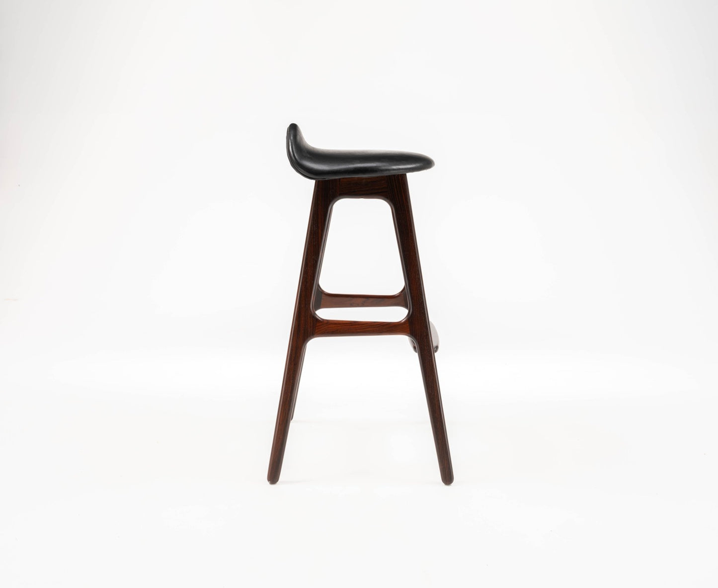 Mid-century modern Erik Buch rosewood bar stool with gently contoured black leather seat and minimalist frame.