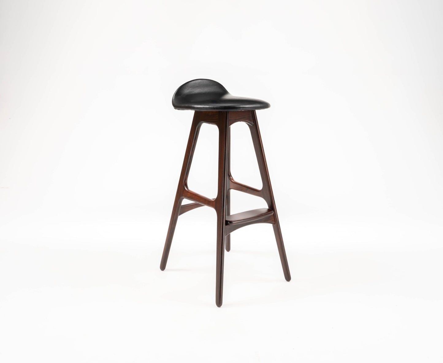 Mid-century modern rosewood bar stool by Erik Buch with contoured black leather seat and sculptural frame design.
