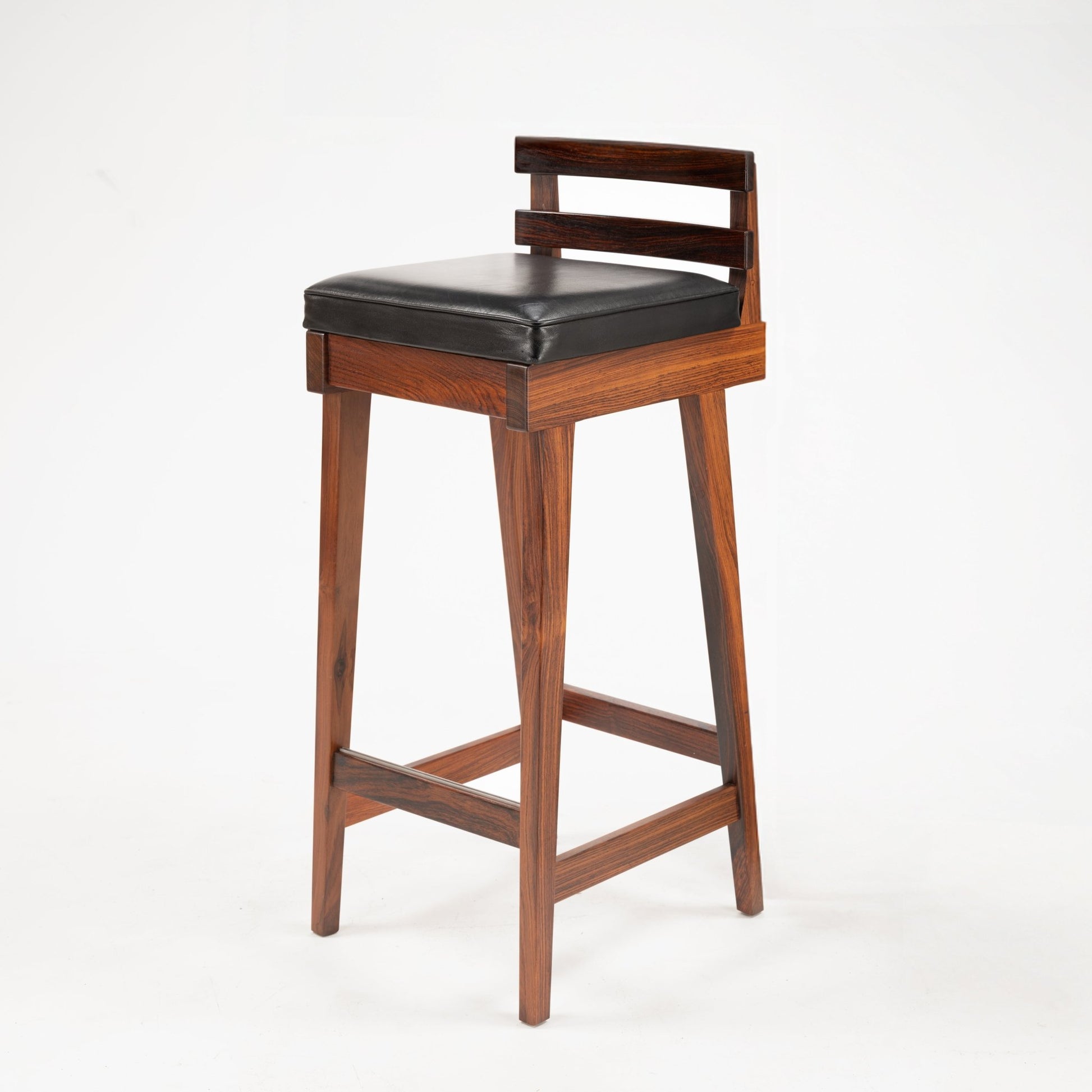 Erik Buck Pair of Rosewood Stools featuring a dark rosewood frame with a rectangular padded black leather seat and a minimalist backrest, representing vintage Danish mid century modern seating.