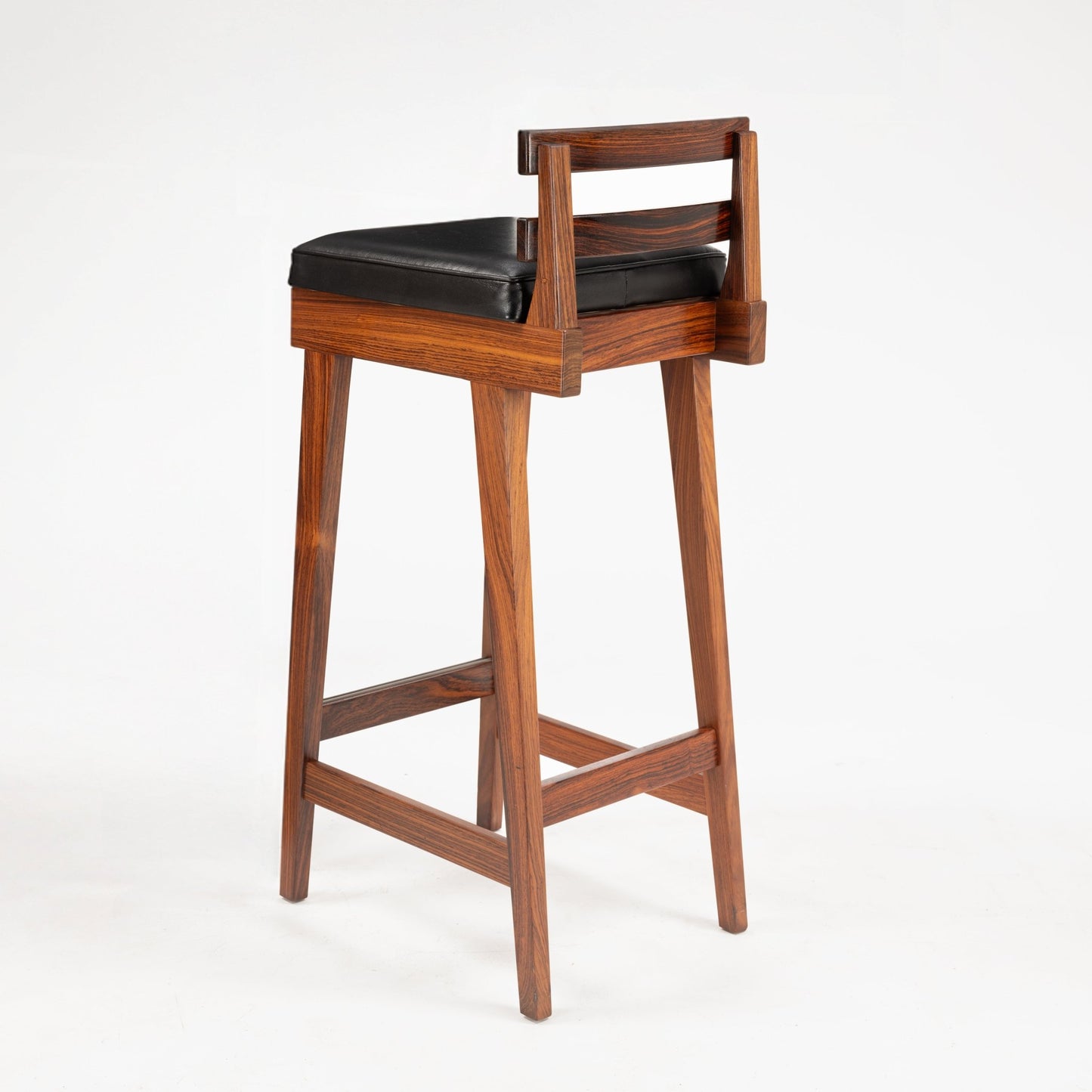 Erik Buck Pair of Rosewood Stools showcasing a tall, slender rosewood frame with a subtle backrest and a black leather cushioned seat, reflecting vintage Danish mid century modern seating design.