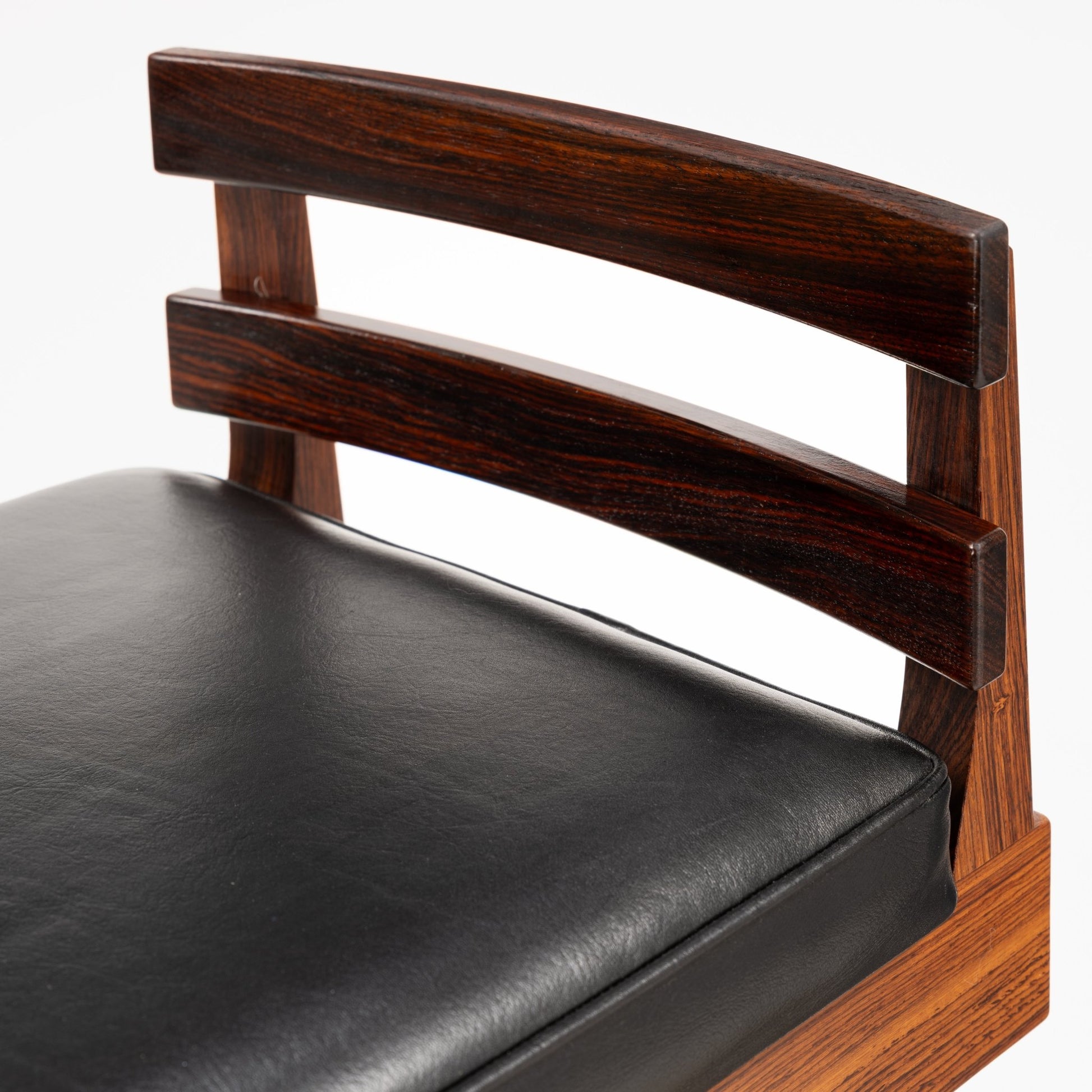 Erik Buck Pair of Rosewood Stools featuring black leather seats with gently curved horizontal back slats in rich rosewood, showcasing elegant vintage Danish mid century modern seating.