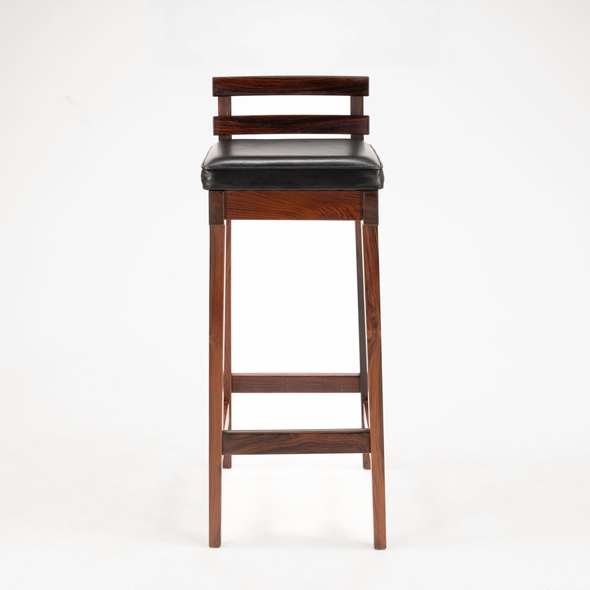 Erik Buck Pair of Rosewood Stools featuring tall, slim rosewood frames with horizontal back slats and a black leather cushioned seat, embodying vintage Danish mid century modern seating design.